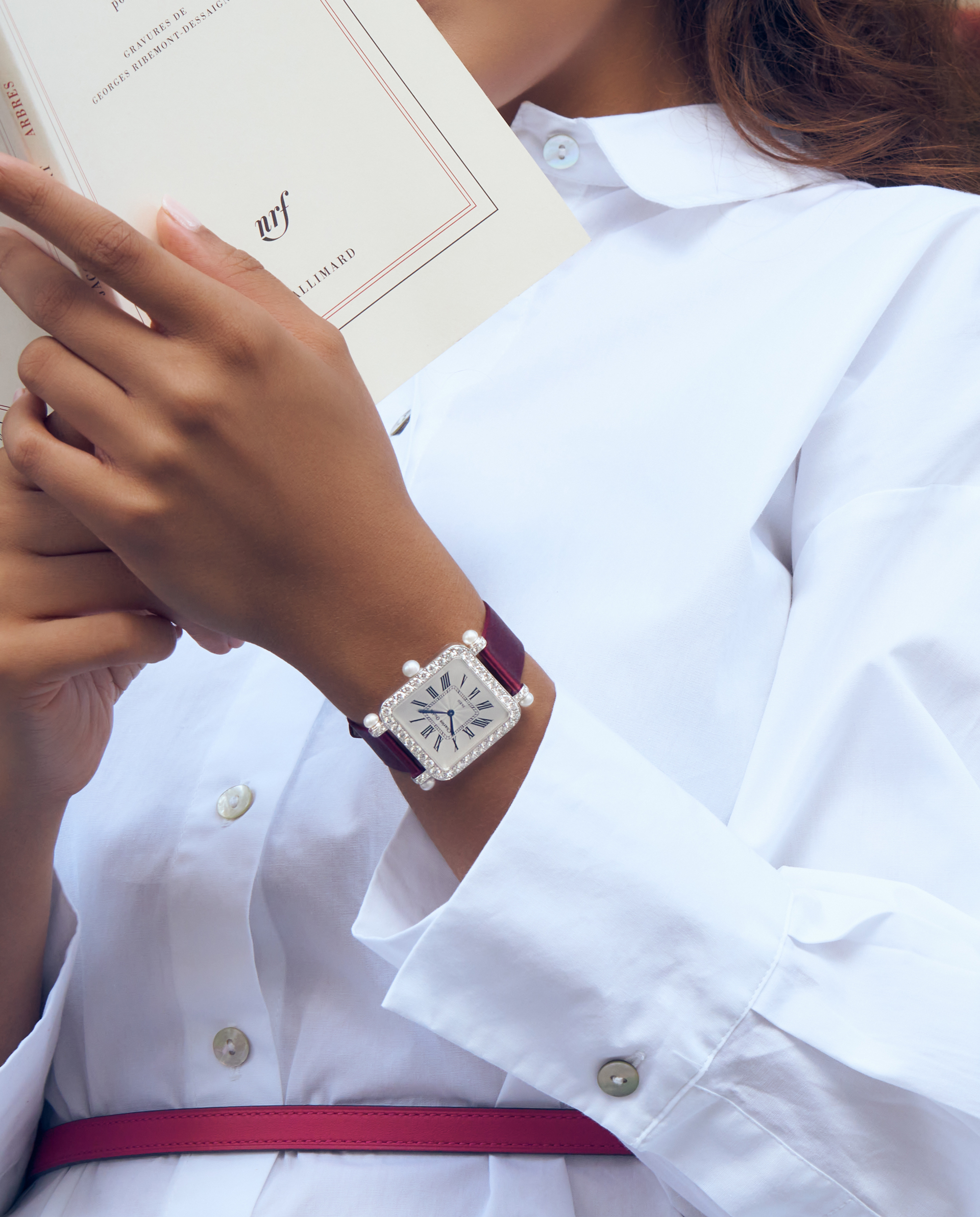 Large Pansy Retro with pearls by Charles Oudin Paris A contemporary Large Pansy Retro with pearls watch in white gold set with diamonds by Charles Oudin Paris on a ladies’wrist.